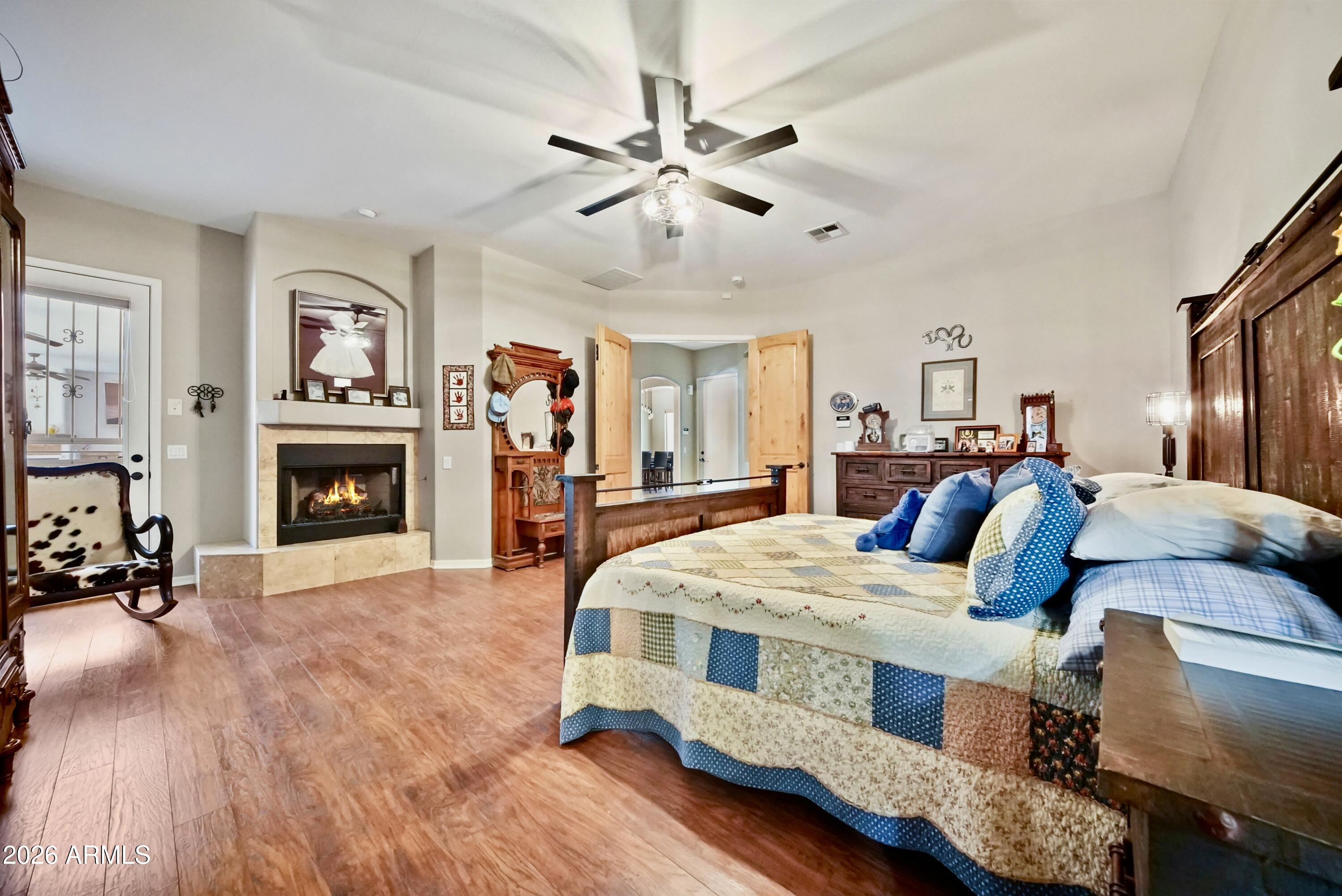 605 West Ridgecrest Road Phoenix, AZ 85086 - Photo 25 of 40 a bed room with a bed and a fireplace