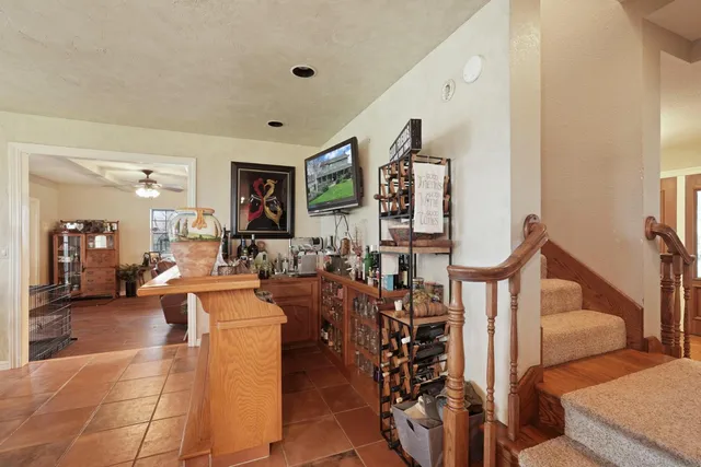 a view of a house with a yard and sitting area