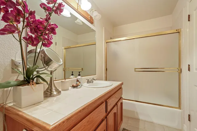 a view of a dining room with furniture and a chandelier