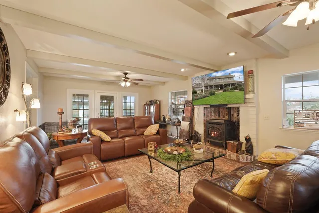 a kitchen with stainless steel appliances kitchen island granite countertop a sink and cabinets
