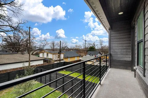 a view of a balcony with sitting area