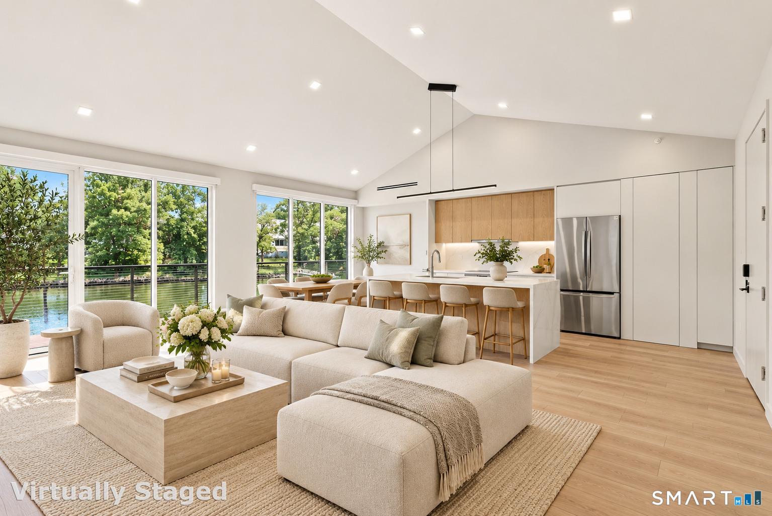 253 Riverside Avenue, Unit 102 Westport, CT 06880 - Photo 1 of 17 This stunning open-concept kitchen and living area is framed by direct Saugatuck River views, filling the residence with natural light and an effortless waterfront feel. Step onto your balcony overlooking the water and enjoy the beauty day and night