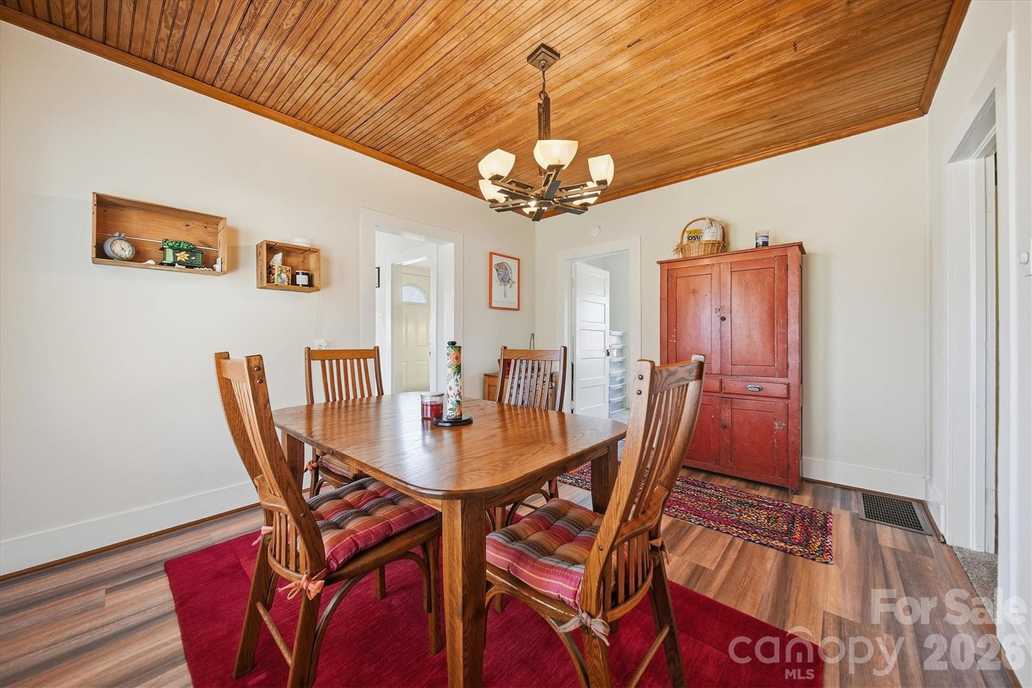 113 Leonhardt Road Morganton, NC 28655 - Photo 14 of 44 a view of a dining room with furniture and a chandelier