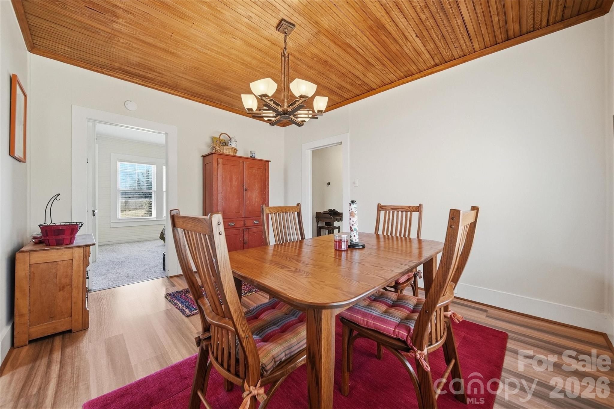 113 Leonhardt Road Morganton, NC 28655 - Photo 15 of 44 a view of a dining room with furniture and wooden floor