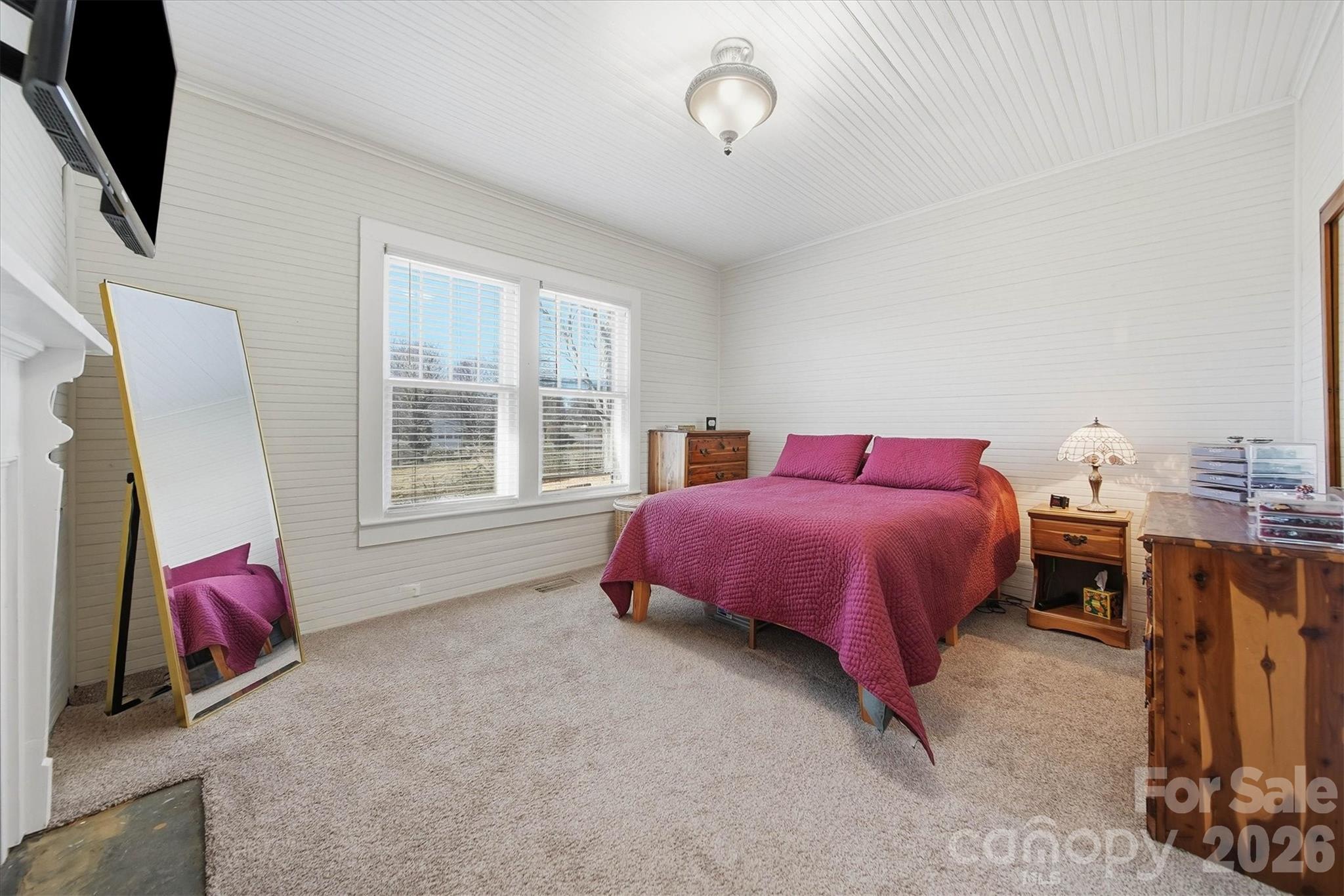 113 Leonhardt Road Morganton, NC 28655 - Photo 16 of 44 a spacious bedroom with a bed and a window