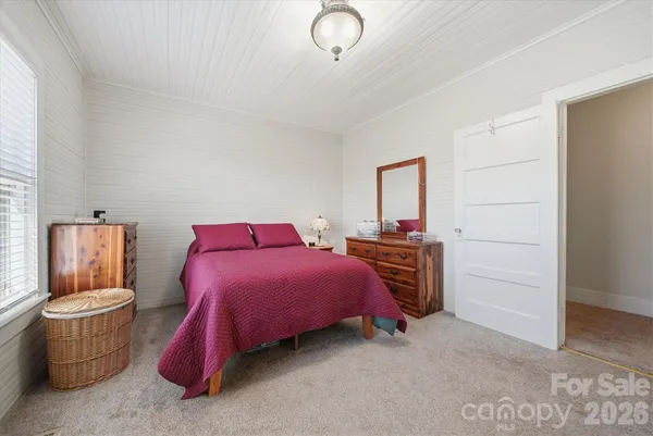 a bedroom with a bed and furniture