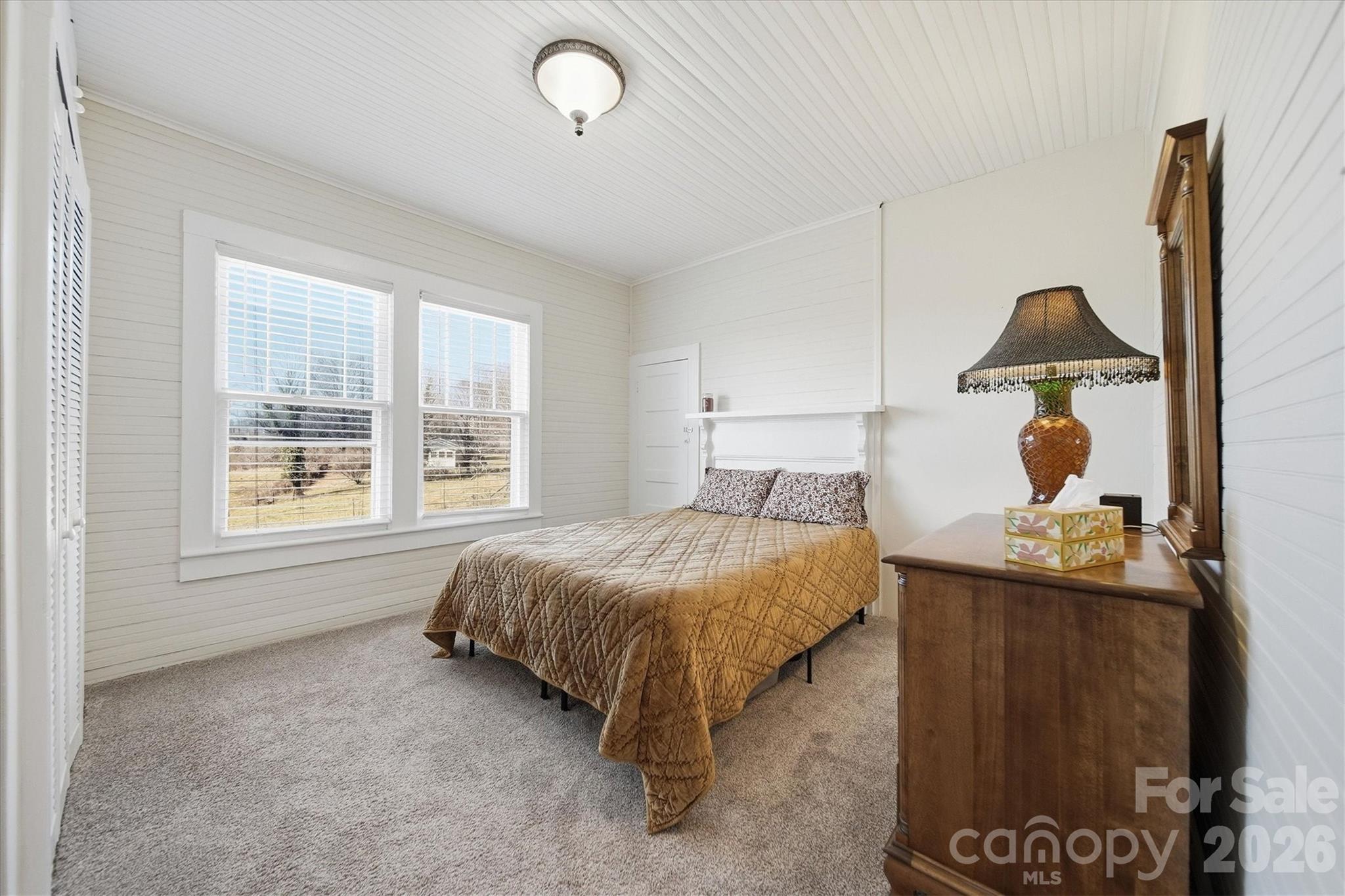 113 Leonhardt Road Morganton, NC 28655 - Photo 27 of 44 a bedroom with a bed and window