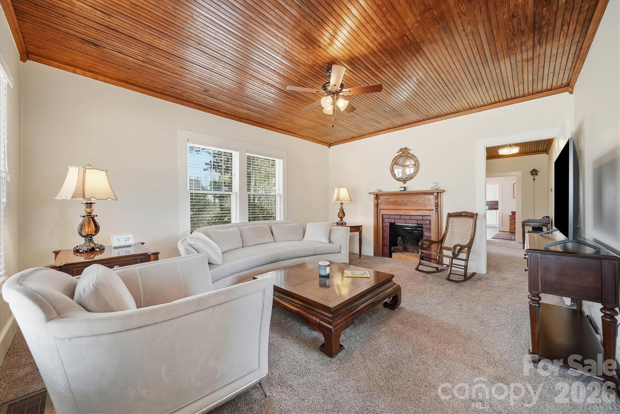 113 Leonhardt Road Morganton, NC 28655 - Photo 3 of 44 a living room with furniture a fireplace and a chandelier