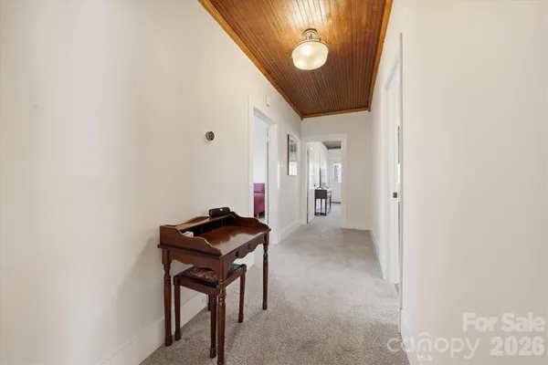 a view of a hallway with workspace
