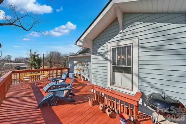 a view of a balcony with furniture