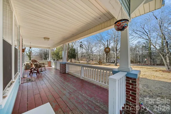 a view of a patio with wooden floor