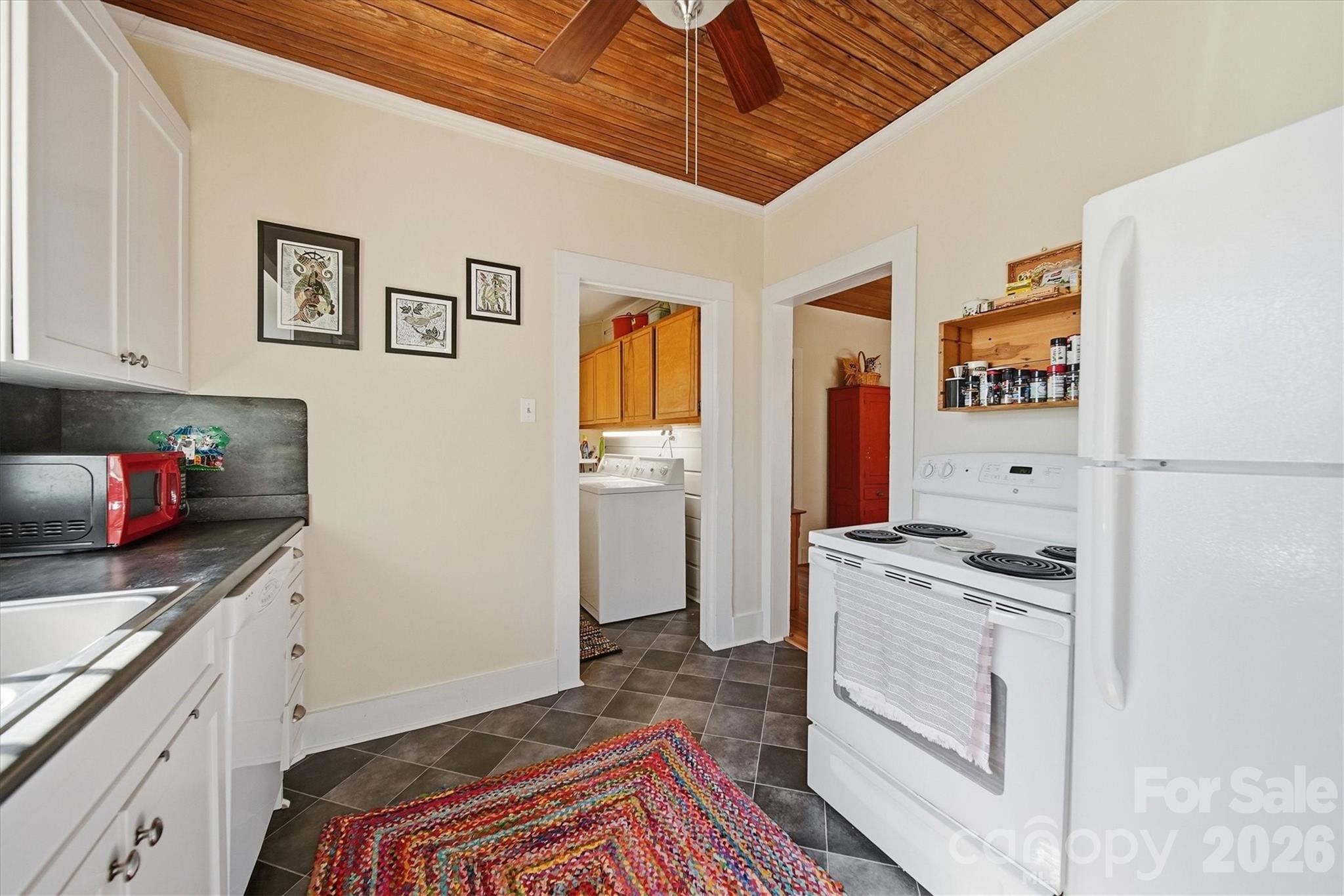 113 Leonhardt Road Morganton, NC 28655 - Photo 10 of 44 a kitchen with stainless steel appliances granite countertop a stove a refrigerator and a microwave