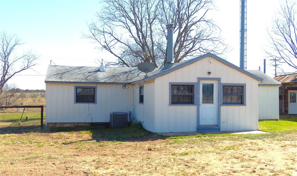 286 North Fm 1851 Voca, TX 76887 - Photo 1 of 23 View of outbuilding featuring fence and central air condition unit