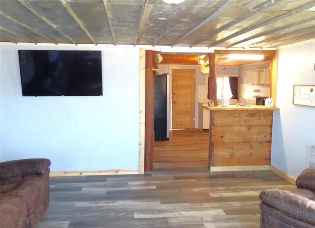 a view of a dining room with furniture and a window