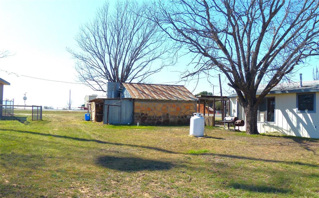 286 North Fm 1851 Voca, TX 76887 - Photo 8 of 23 View of yard featuring fence and an outdoor structure