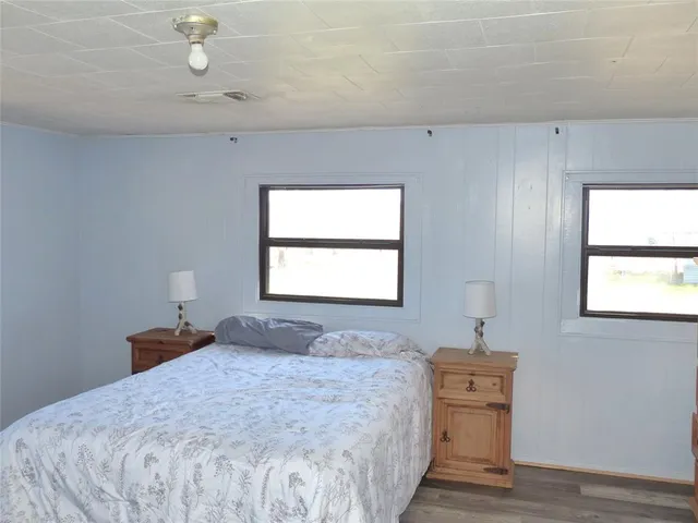 a bathroom with a sink a toilet and shower curtain