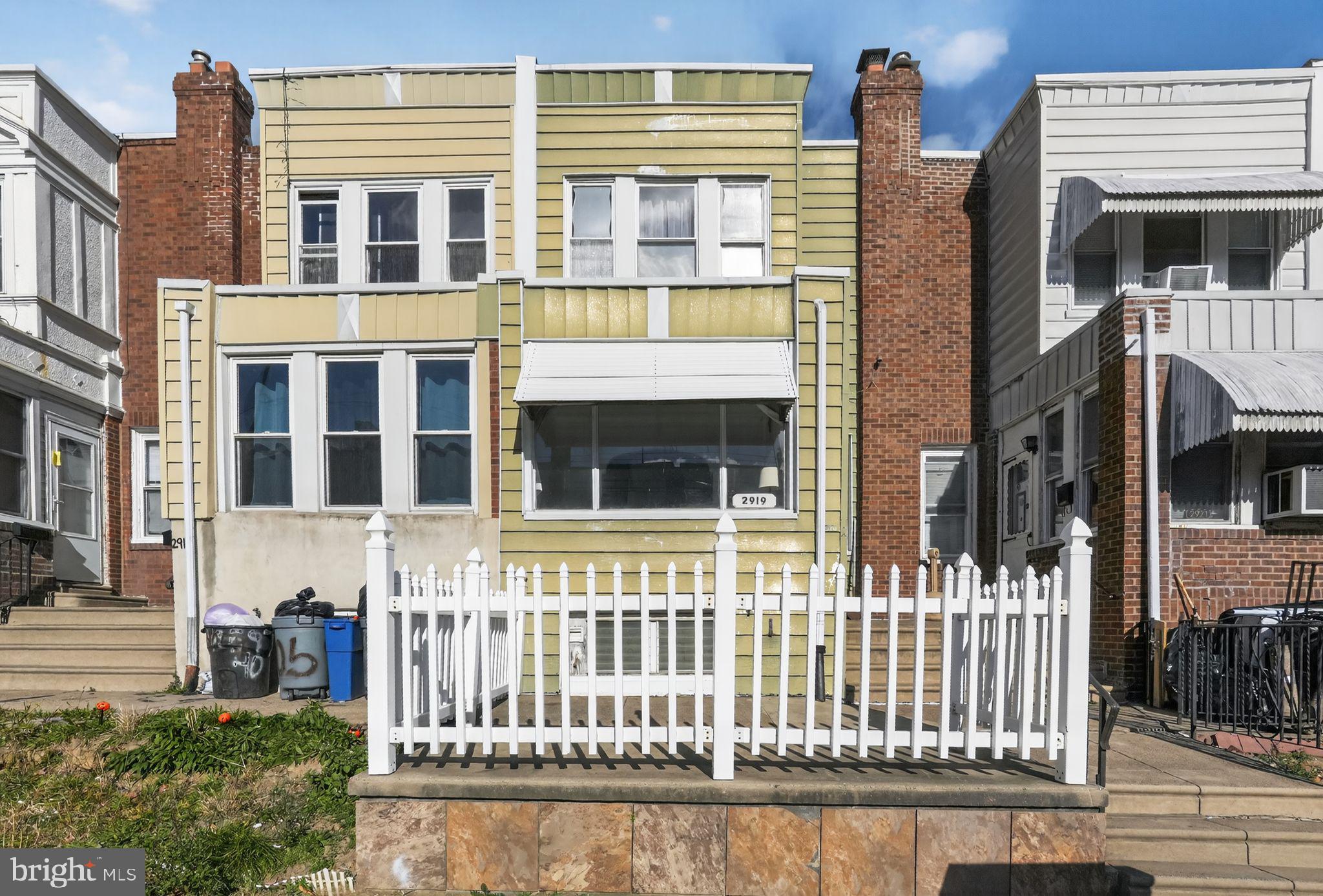2919 Robbins Street Philadelphia, PA 19149 - Photo 2 of 32 a front view of a building with a garden