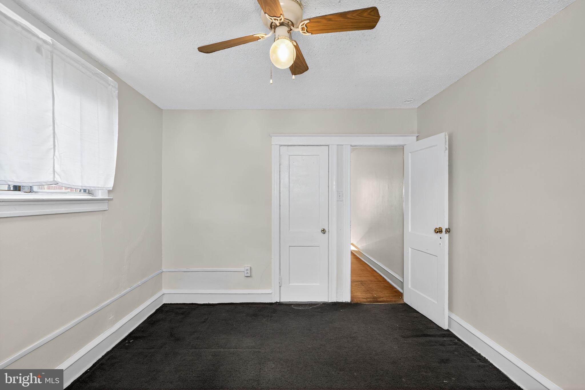2919 Robbins Street Philadelphia, PA 19149 - Photo 25 of 32 a view of an empty room with wooden floor and windows