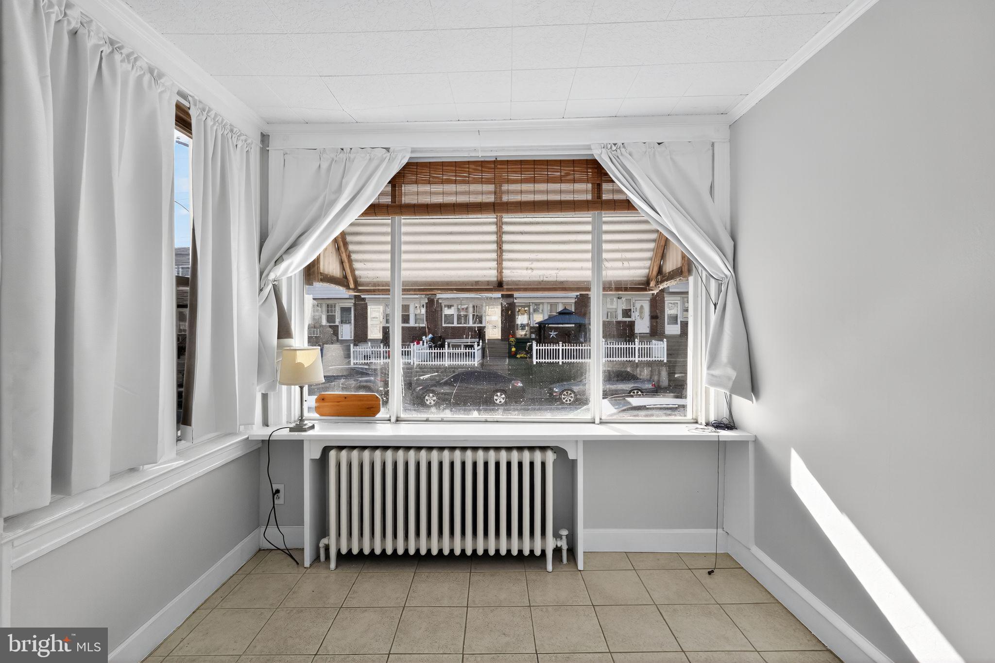2919 Robbins Street Philadelphia, PA 19149 - Photo 6 of 32 a room with window and a table