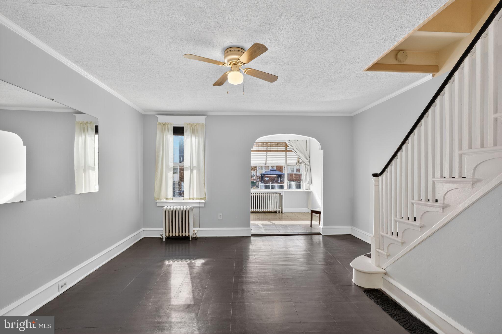 2919 Robbins Street Philadelphia, PA 19149 - Photo 8 of 32 a view of empty room with wooden floor and fan