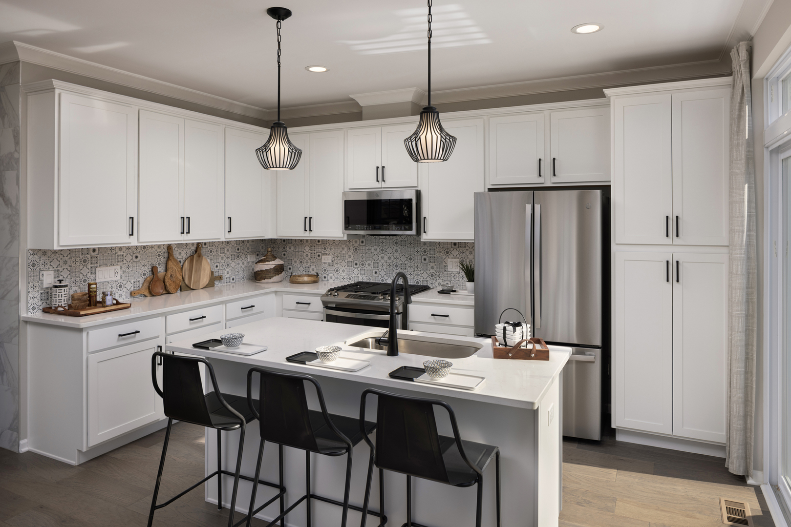 301 Timberleaf Circle Roselle, IL 60172 - Photo 2 of 17 a kitchen with stainless steel appliances a stove a refrigerator a sink a stove a table and chairs