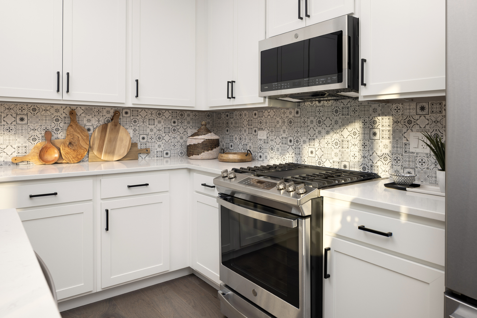 301 Timberleaf Circle Roselle, IL 60172 - Photo 3 of 17 a kitchen with stainless steel appliances white cabinets and a stove top oven