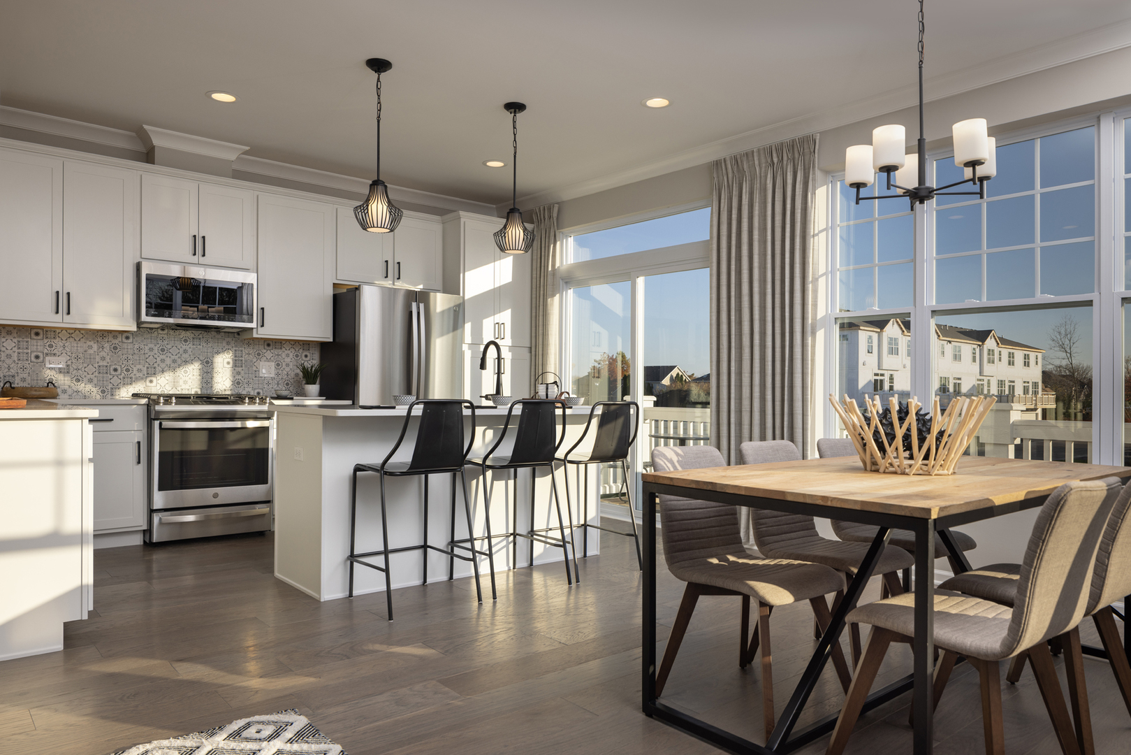301 Timberleaf Circle Roselle, IL 60172 - Photo 6 of 17 a kitchen with stainless steel appliances kitchen island granite countertop a table chairs and a view of living room