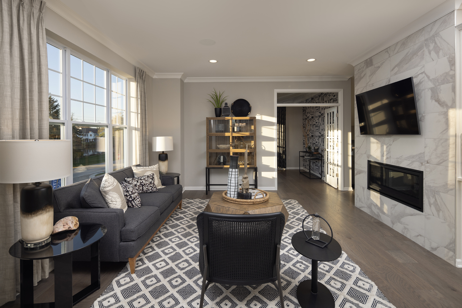 301 Timberleaf Circle Roselle, IL 60172 - Photo 9 of 17 a living room with furniture a flat screen tv and a fireplace