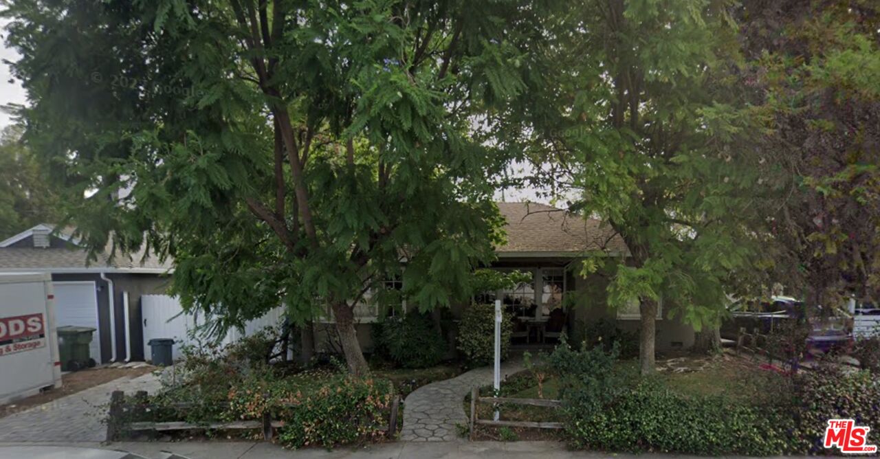 5244 Forbes Avenue Encino, CA 91316 - Photo 1 of 1 a front view of a house with garden