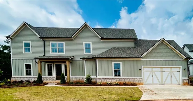 a front view of a house with swimming pool