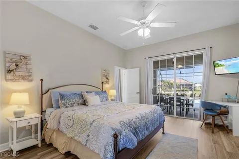 a bedroom with a large bed and a large window