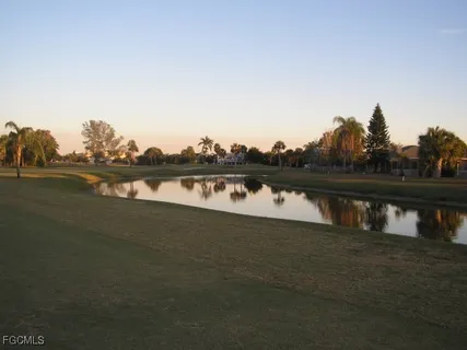 a view of a lake with tall building
