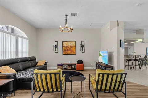 a view of a livingroom with furniture and a window