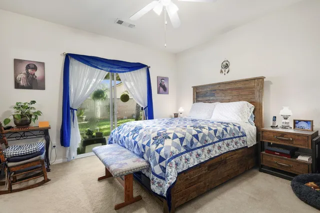 a bedroom with a bed and a dresser in it