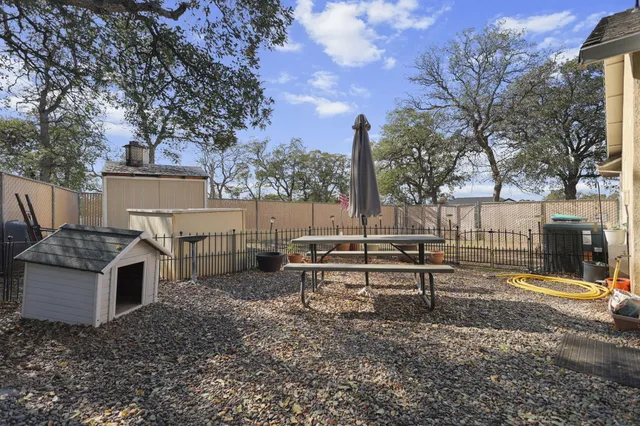 a view of a bench in a backyard