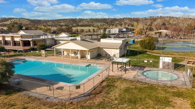 a view of a backyard with sitting area