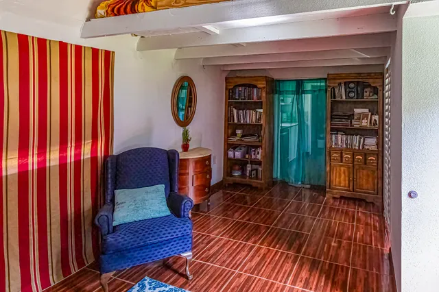 a view of a livingroom with furniture window and wooden floor