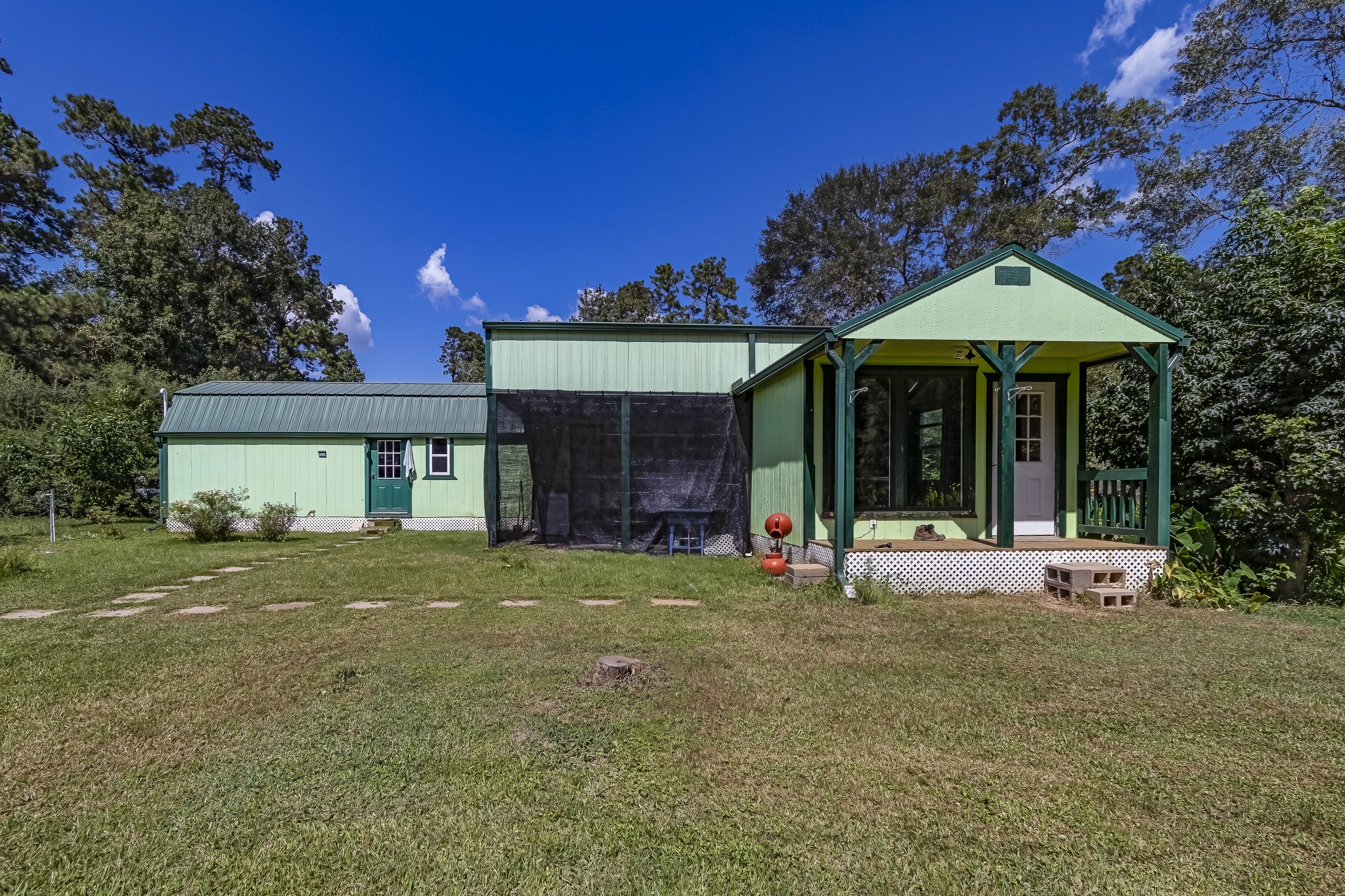 121 Tidwell Road Shepherd, TX 77371 - Photo 15 of 21 a front view of a house with a yard and trees
