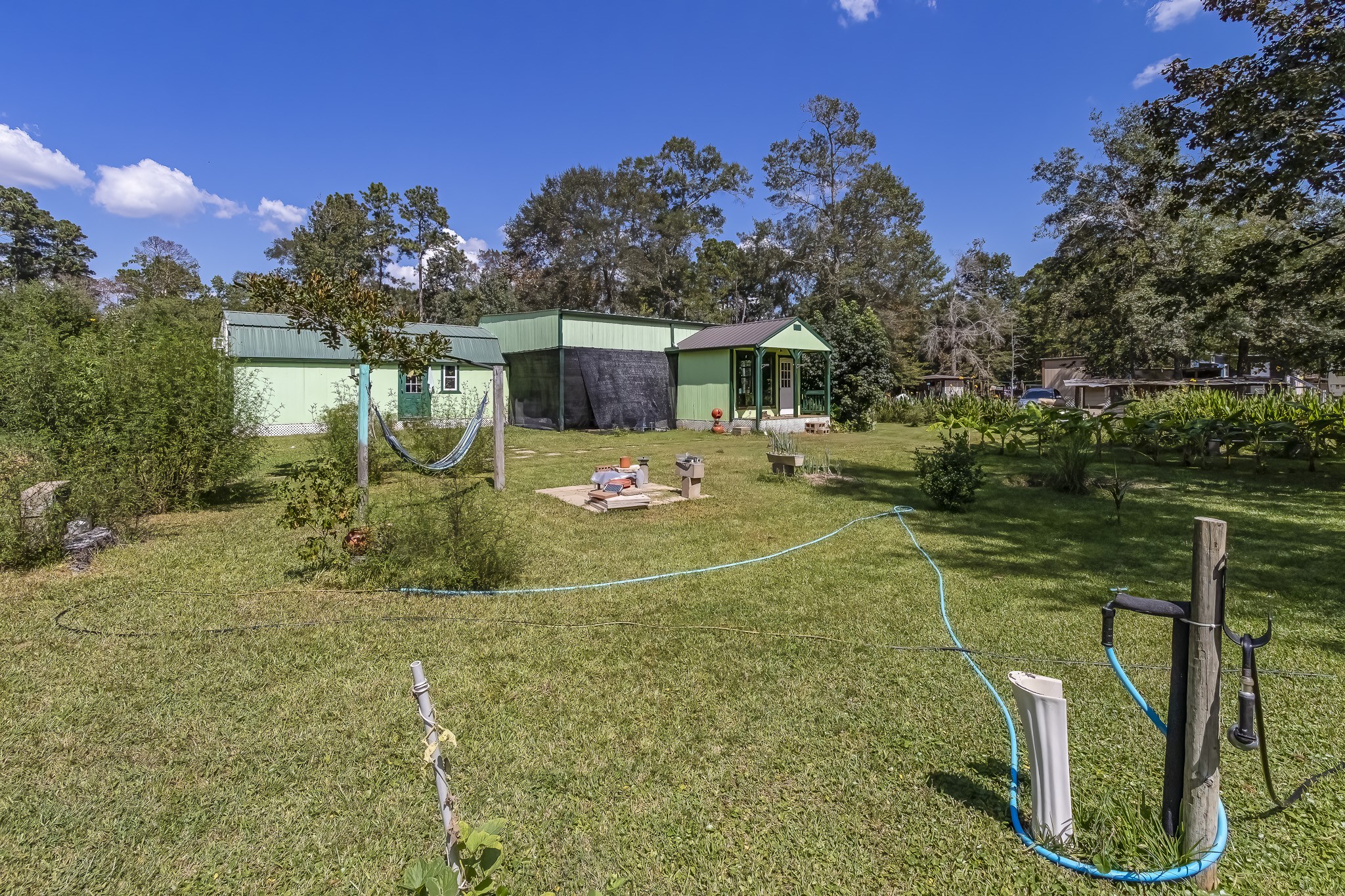 121 Tidwell Road Shepherd, TX 77371 - Photo 21 of 21 a front view of a house with garden
