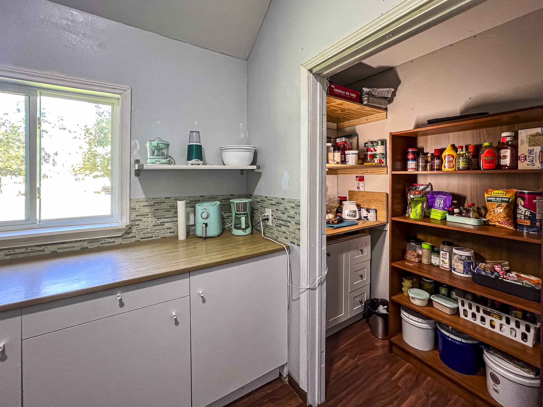 121 Tidwell Road Shepherd, TX 77371 - Photo 8 of 21 a kitchen with stainless steel appliances cabinets and a window