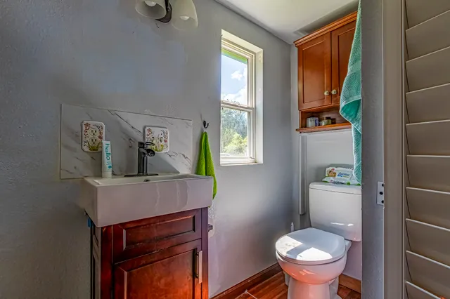 a room with a wooden floor and a table