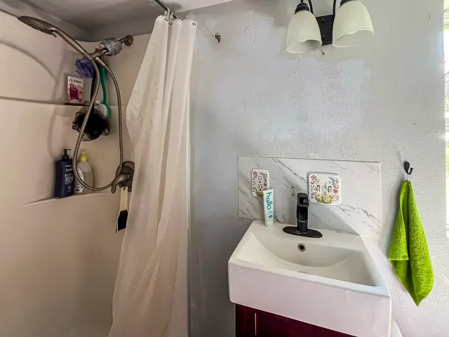 a bathroom with a sink and mirror