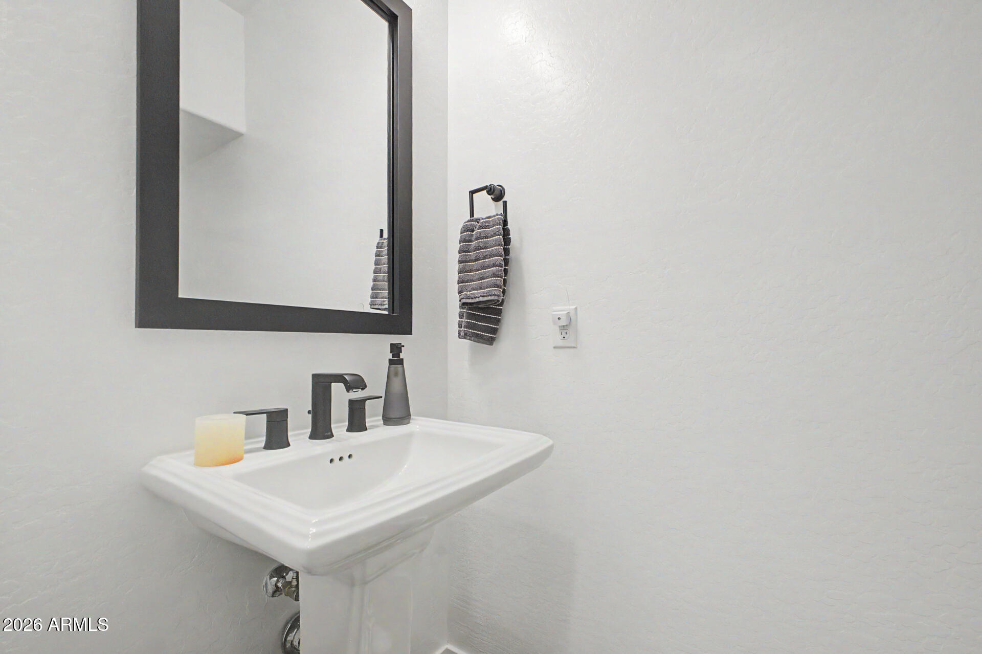 819 West Deer Creek Road Phoenix, AZ 85048 - Photo 31 of 76 a bathroom with a sink and a mirror