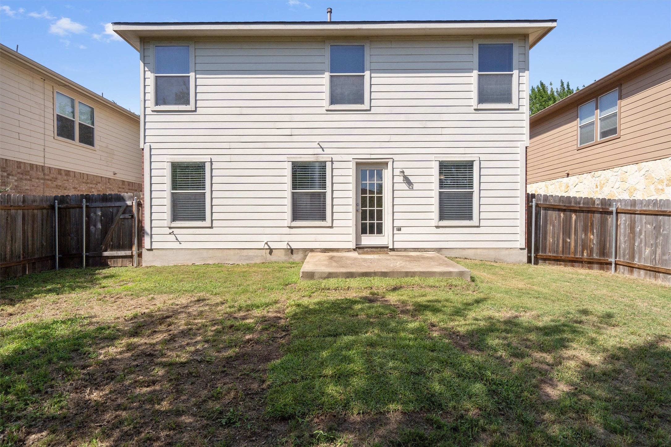 5825 Silver Screen Drive Austin, TX 78747 - Photo 27 of 40 A private backyard oasis with a patio and a fully fenced perimeter, perfect for outdoor enjoyment.