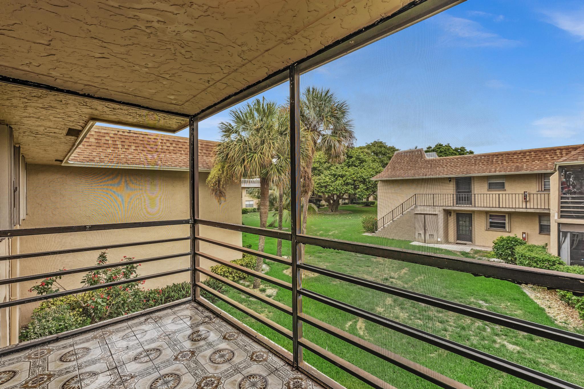 1291 Northwest 13th Street, Unit 445D Boca Raton, FL 33486 - Photo 13 of 50 a view of a building from a balcony