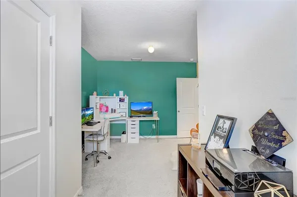 a workspace with furniture and a wooden floor