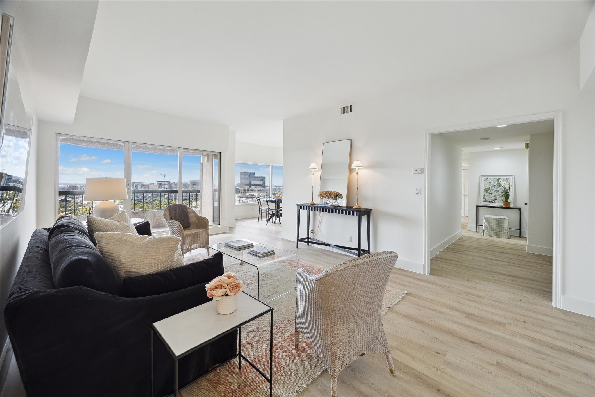 a living room with furniture or kitchen view and a wooden floor