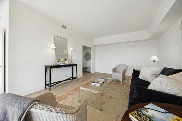 a bedroom with a bed and a lamp