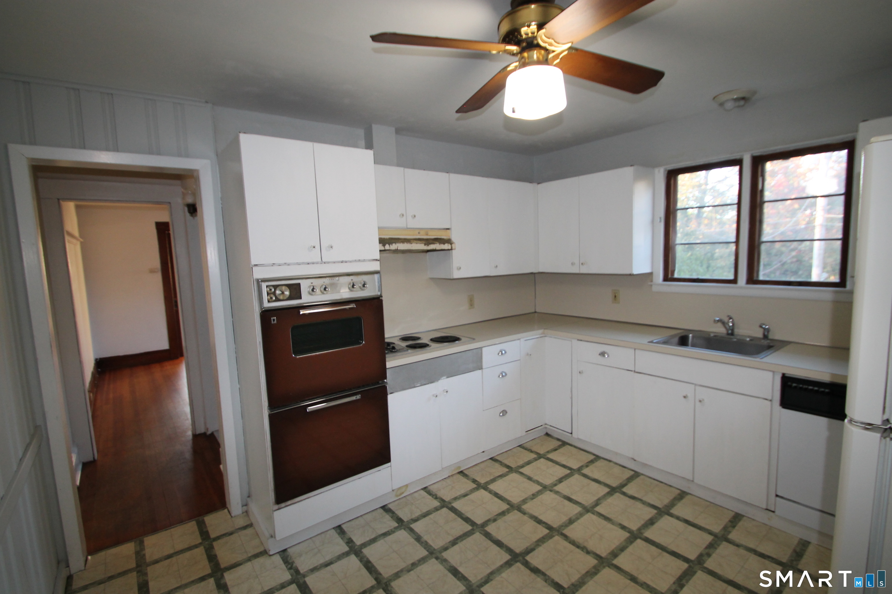 156 Blakeman Place Stratford, CT 06615 - Photo 29 of 33 a kitchen with a sink cabinets and appliances
