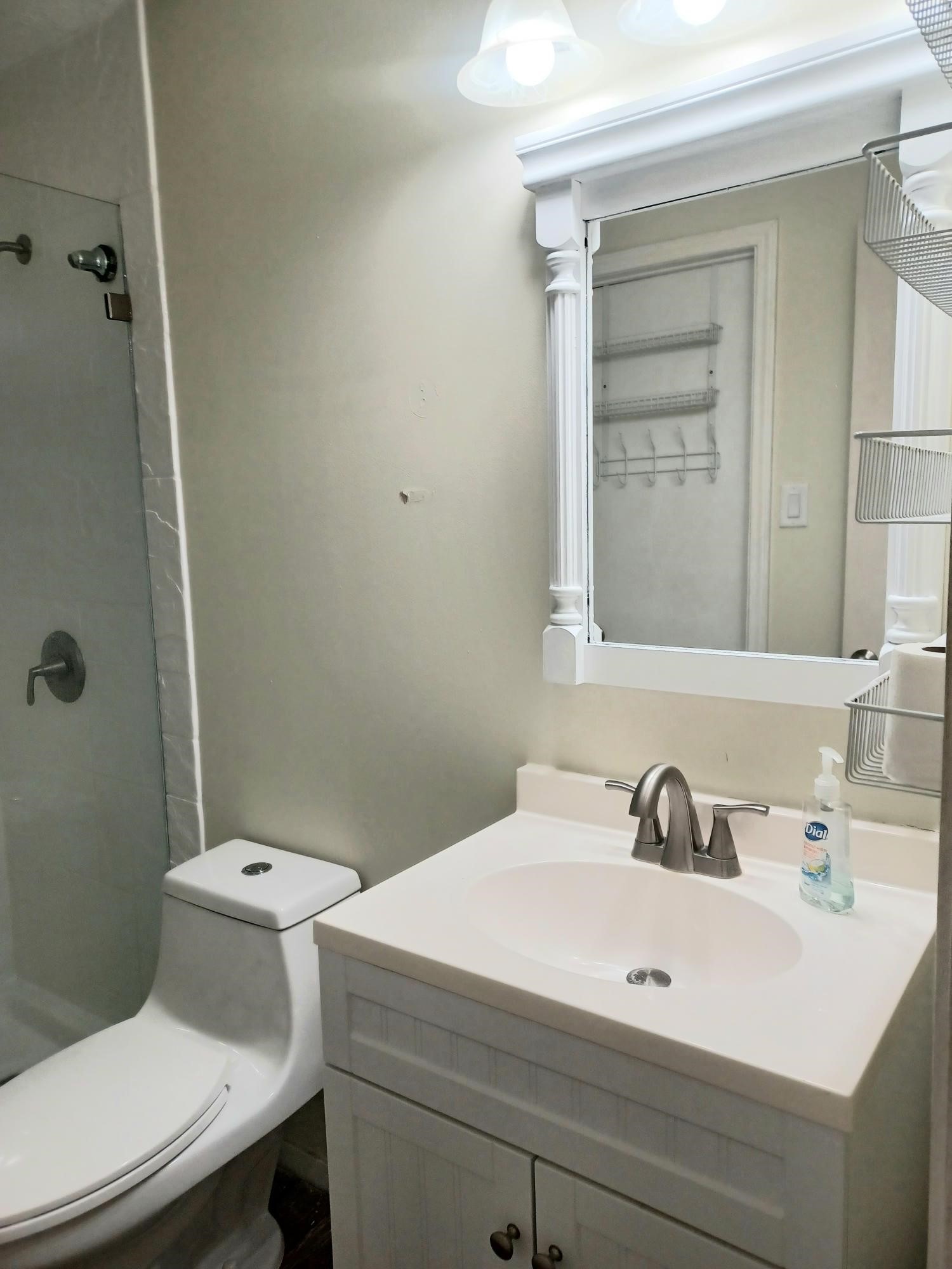 128 April Point Drive South Conroe, TX 77356 - Photo 17 of 26 a bathroom with a sink a toilet and shower